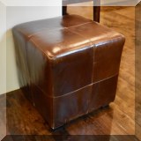 F12. Pair of square leather ottomans. 17”h x 17”w x 17”d 